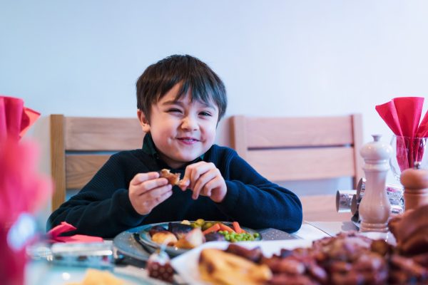 happy-kid-eating-sunday-dinner-at-home-child-boy-2025-02-24-10-16-45-utc